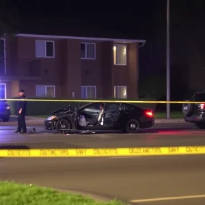 Scene of a car crash related to drag racing at an apartment complex.