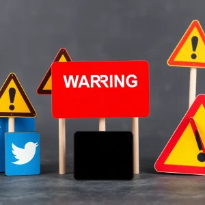 A graphic showing social media platforms with warning signs about controversial comments.